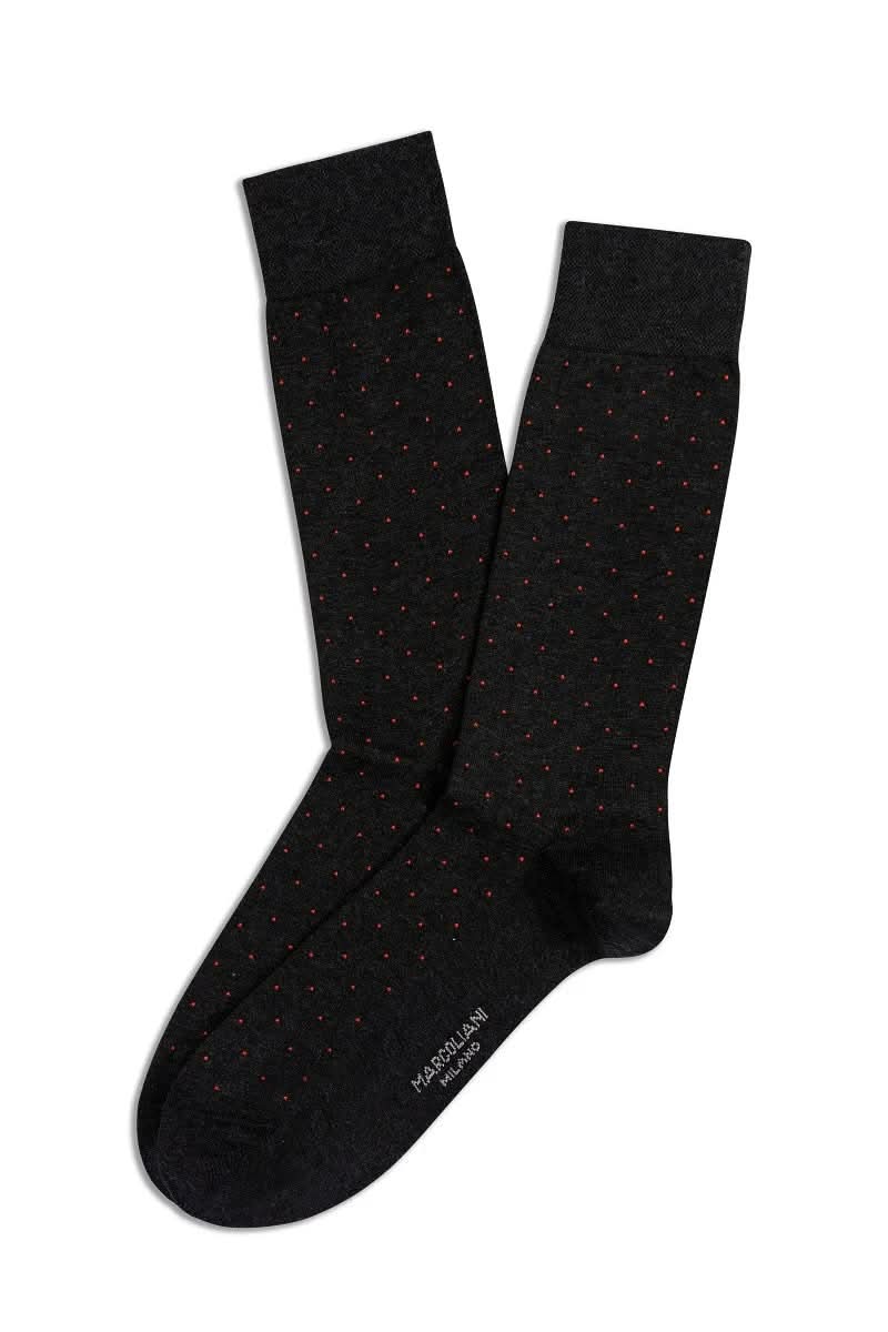 Bas à pois noirs élégants, confortables et extensibles pour un look professionnel ou décontracté.