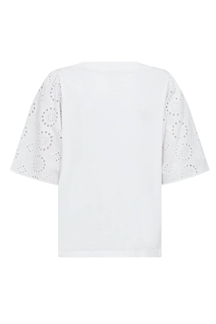 Blouse blanche à manches brodées, coupe ample, en coton biologique pour un style moderne.