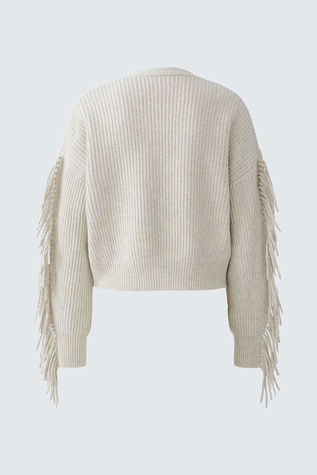 Cardigan avec franges beige en tricot de coton et laine, dos avec manches ornées de franges, coupe ample et moderne, décolleté en V profond.