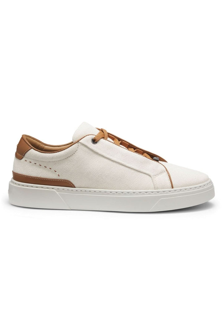 Chaussure de ville Ecru avec toile légère, finitions en cuir et lacets élastiqués pour un style élégant et décontracté.
