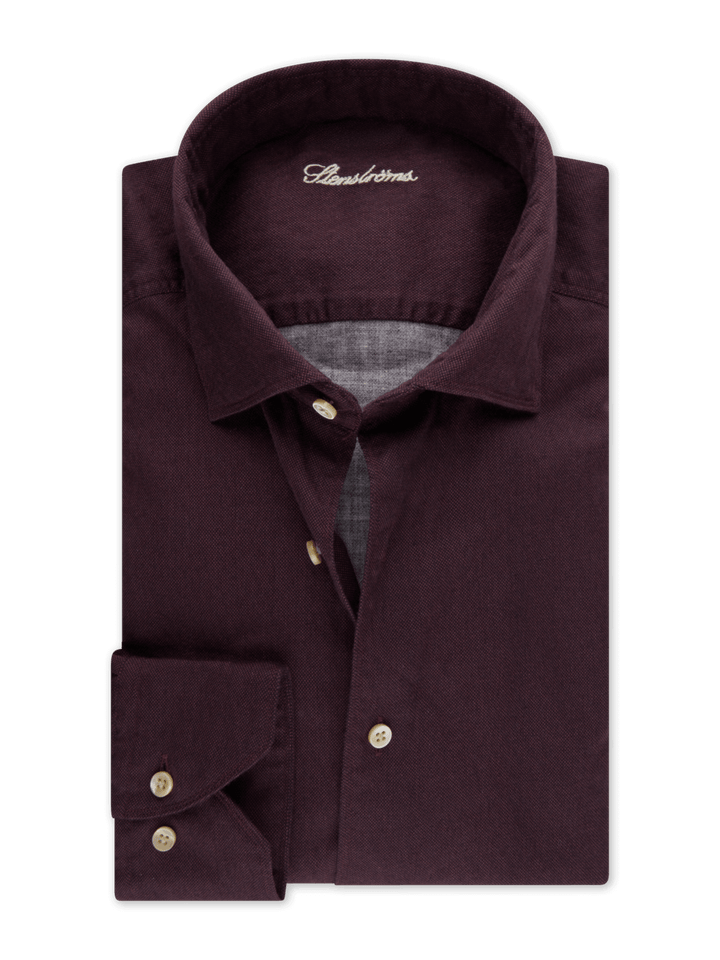 Chemise sport en coton souple avec col semi-italien et fermeture boutonnée, idéale pour une allure sophistiquée et polyvalente.