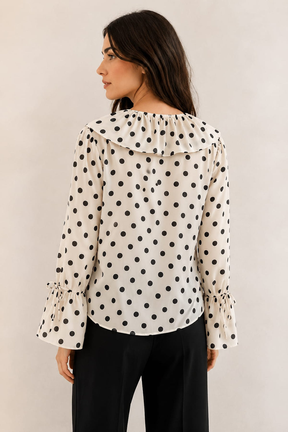 Front view of a black polka-dot collarless blouse with a ruffled collar Oui for women - Valérie Simon