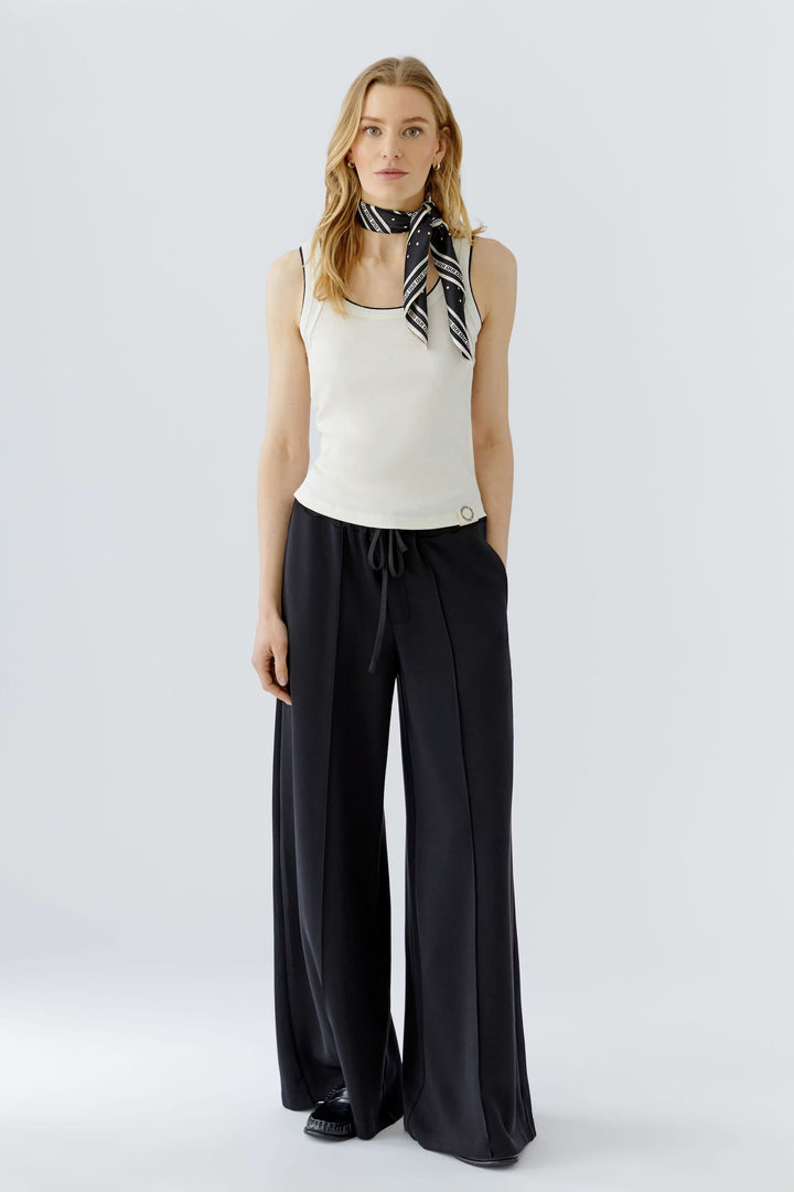 Front view of a black-and-white polka-dot scarf Oui for women with textured detailing - Valérie Simon