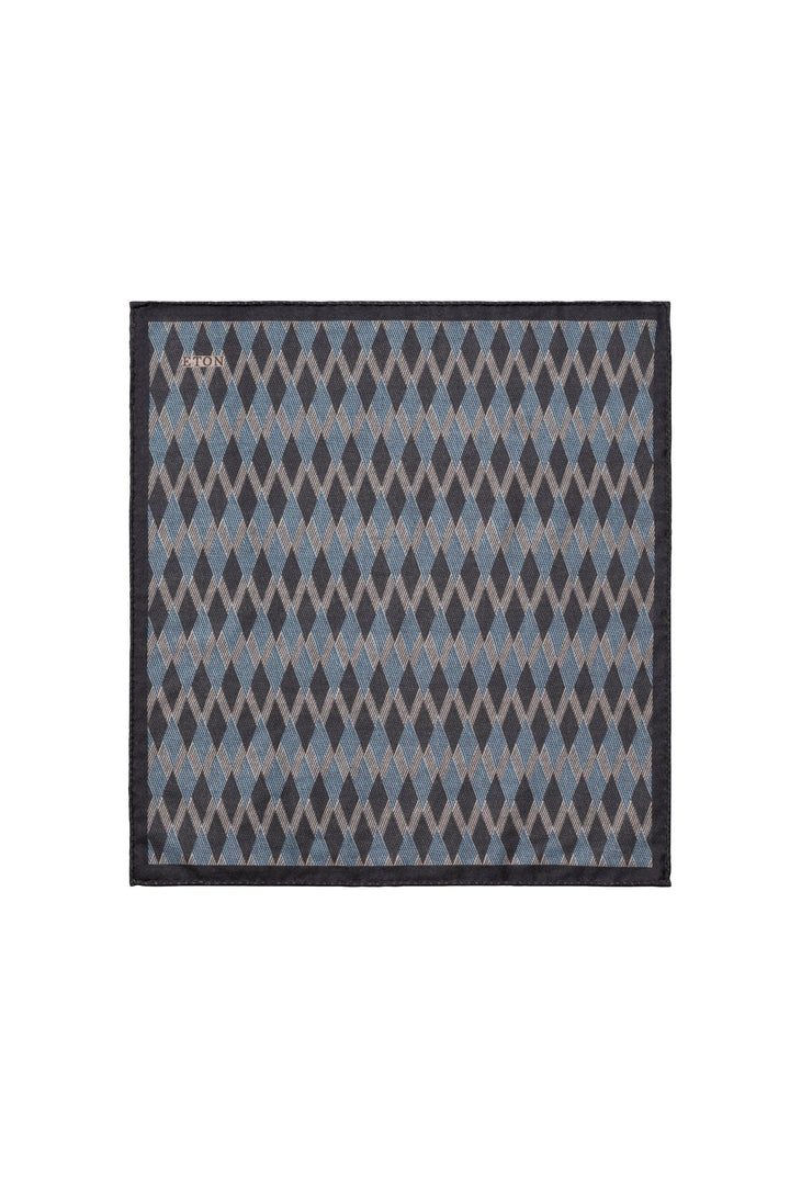 Close-up of a white and blue Eton silk diamond-patterned scarf for men - Valérie Simon