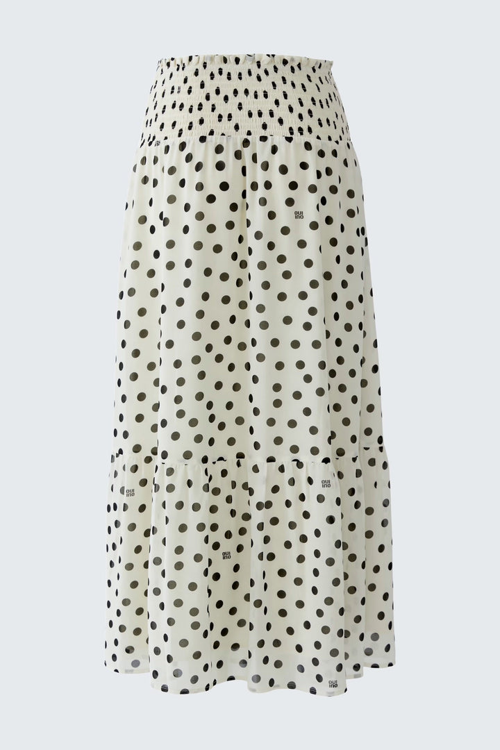 Side view of a long skirt with black and white polka dots Oui for women - Valérie Simon