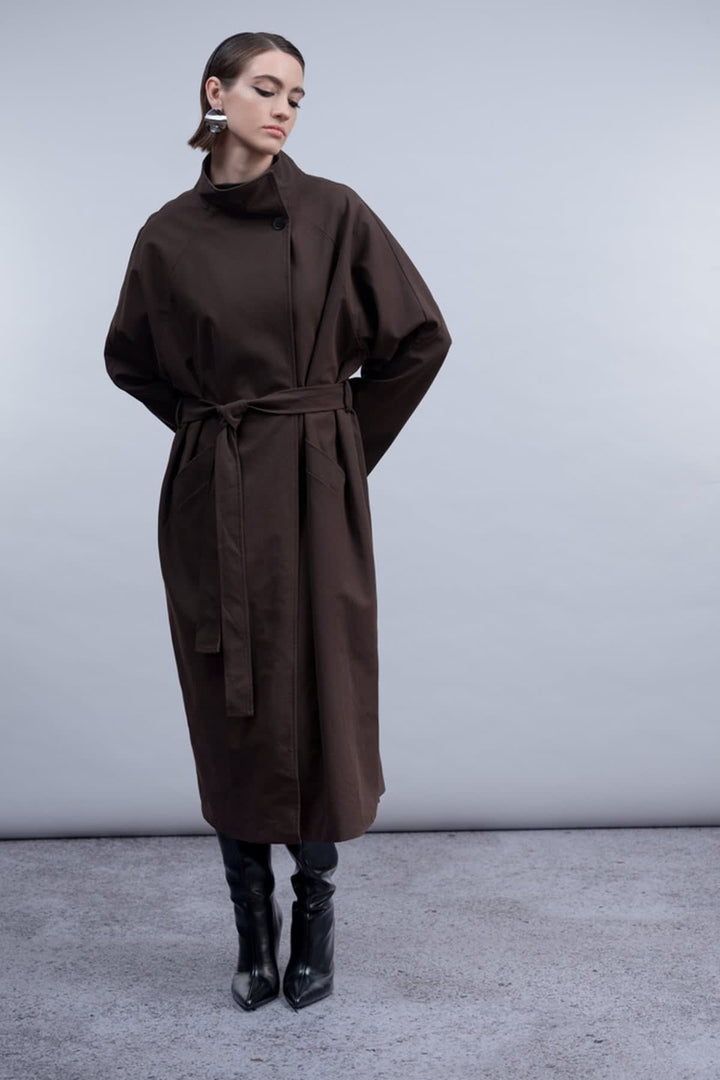 Front view of the Haako belted coat for women in beige with a chest pocket - Valérie Simon