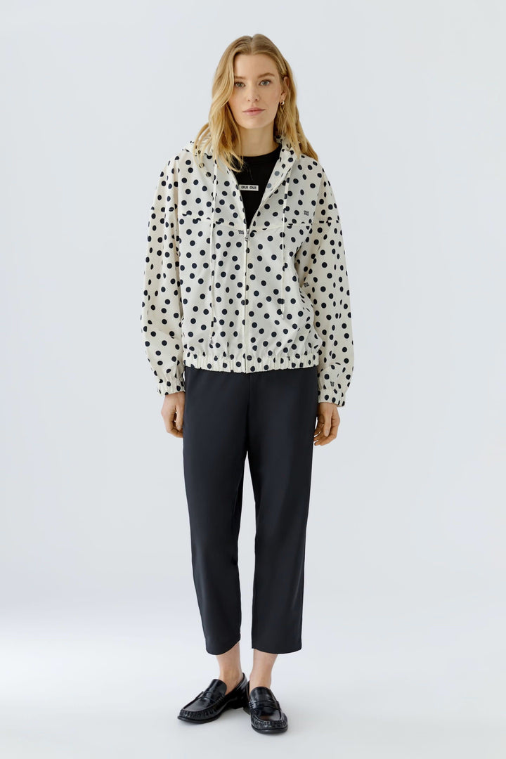 Front view of a black-polka-dot coat Oui for women in beige - Valérie Simon
