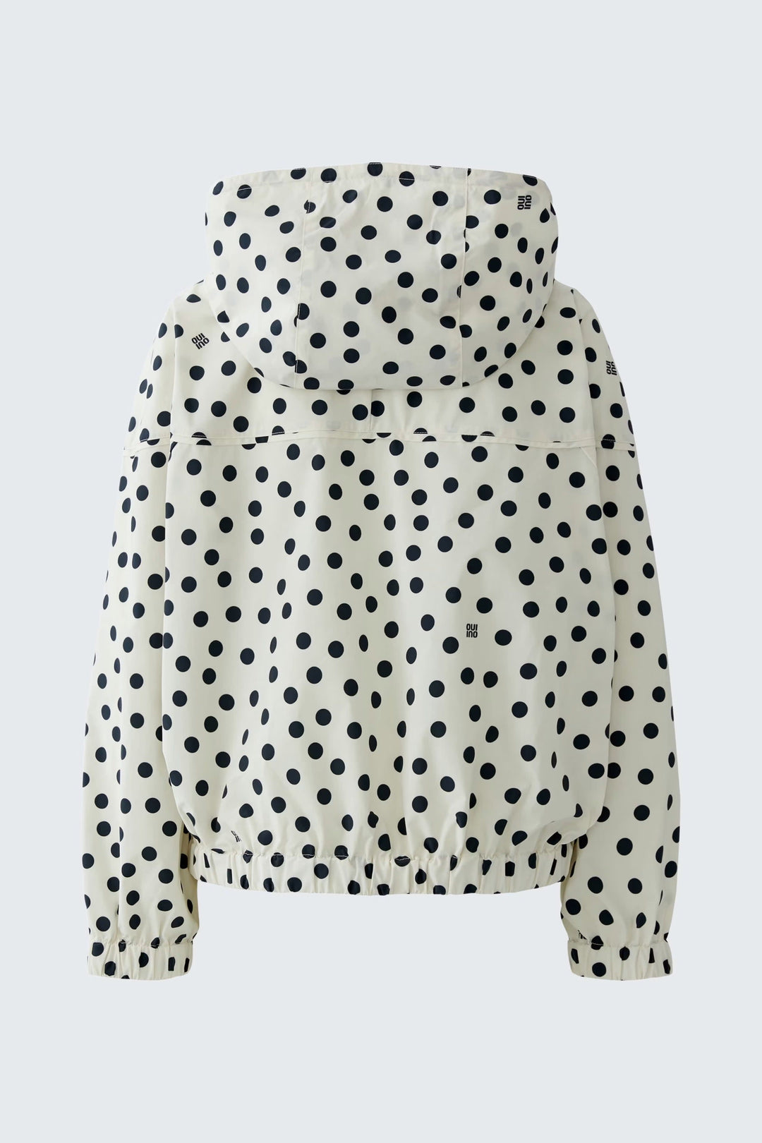 Front view of a black-and-white polka-dot coat Oui for women with a hood - Valérie Simon