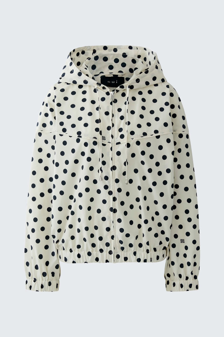 Front view of a black-and-white polka-dot women&