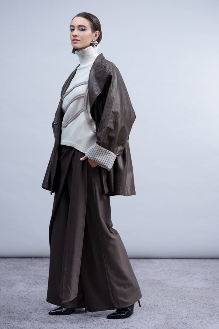 Front view of the Haako brown faux leather coat for women with a belt and gold buttons - Valérie Simon