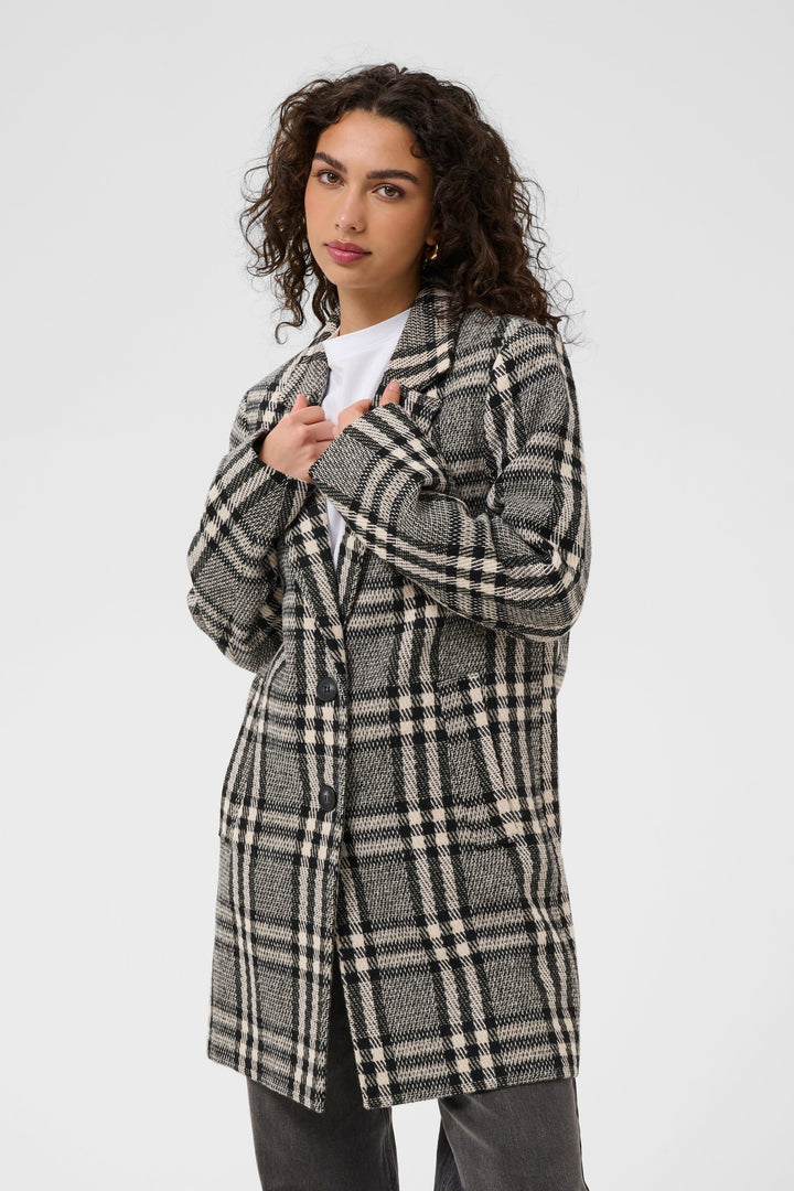 Side view of a Kaffe gray-and-white plaid women&