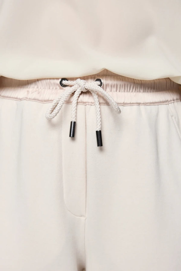Casual pants with black satin stripes, front view, close-up details - Marc Cain for women - Valérie Simon