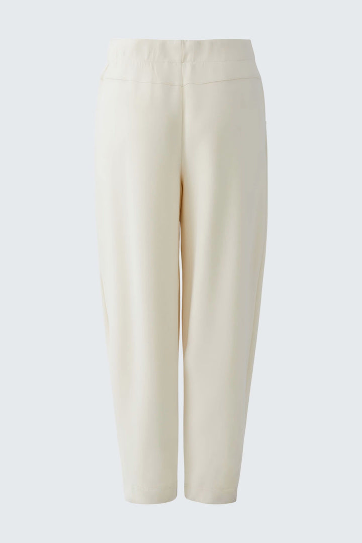 Side view of chic, pull-on beige joggers Oui with side stripes and pockets for women - Valérie Simon