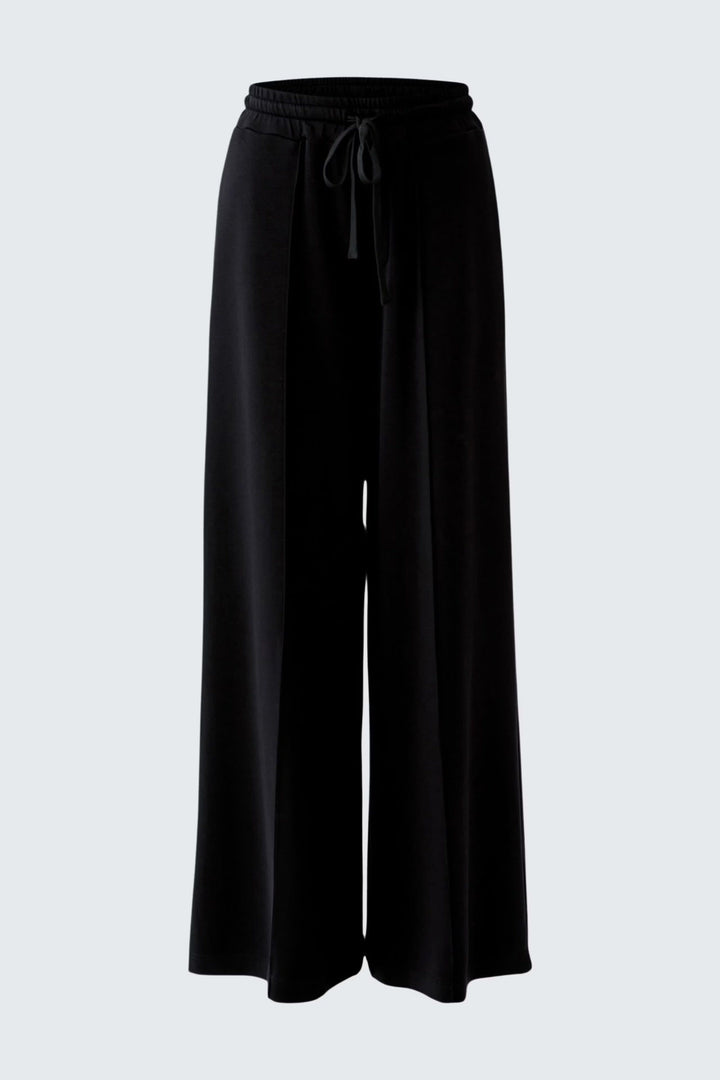 Front view of wide-leg white linen pants with an elastic waistband Oui for women - Valérie Simon