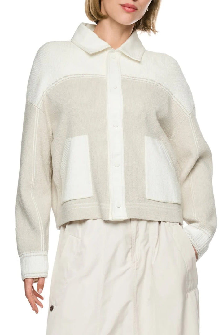 Side view of a red Marc Cain textured knit jacket for women with sleeves - Valérie Simon