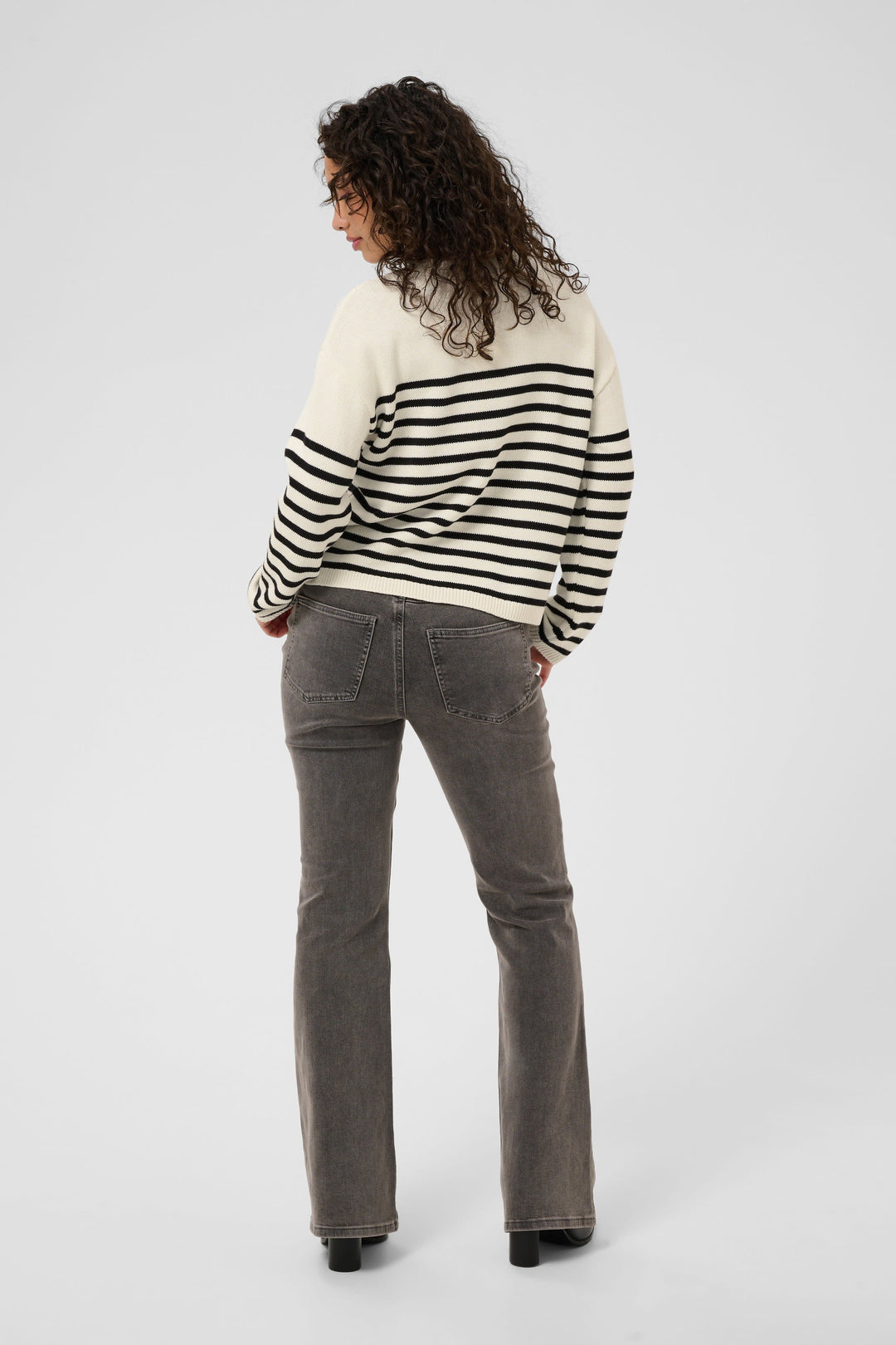 Front view of a striped knit top with "Kaffe" lettering for women in white and black - Valérie Simon