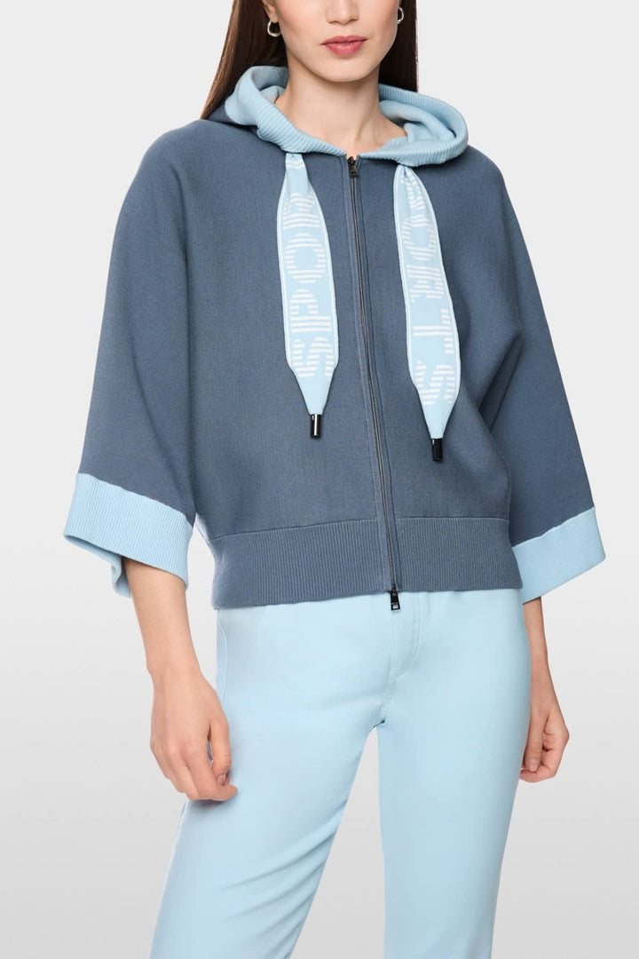 Front view of a blue Marc Cain hooded jacket for women with stitching details - Valérie Simon