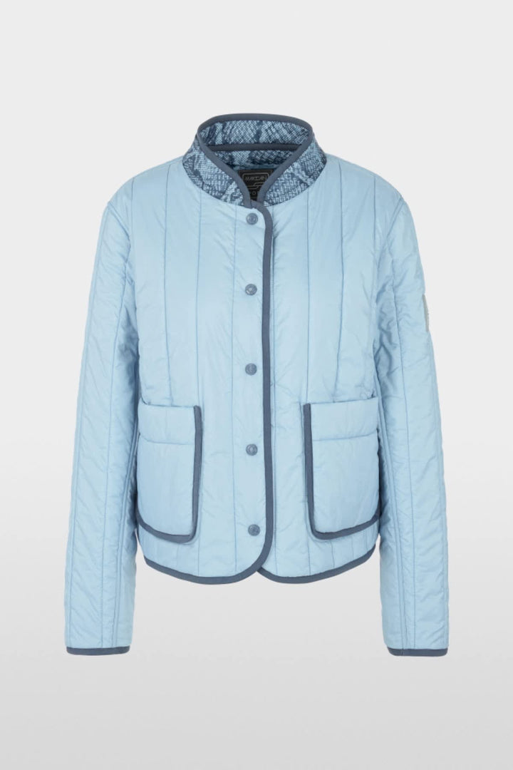 Side view of a blue Marc Cain reversible jacket for women with distinctive quilting - Valérie Simon