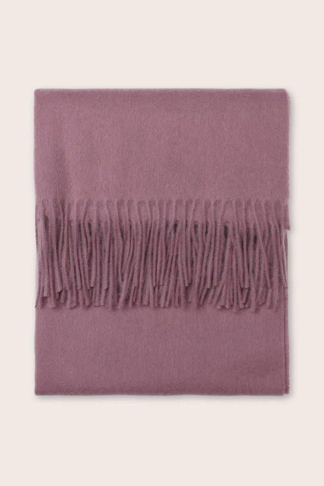 Foulard Anna en laine, couleur rose, avec franges, doux et chaud pour ajouter une touche de couleur à votre tenue.