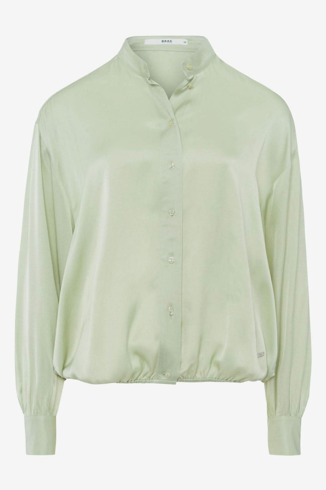 Blouse sans col en viscose confortable, manches bouffantes, coupe droite, couleur vert pâle.