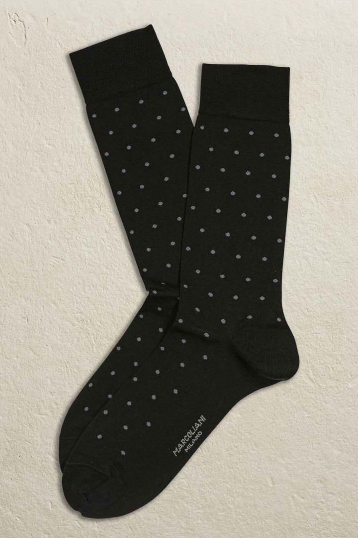 Chaussettes italiennes noires avec pois bleus, modernes et stylées, 72% coton et 28% polyester.