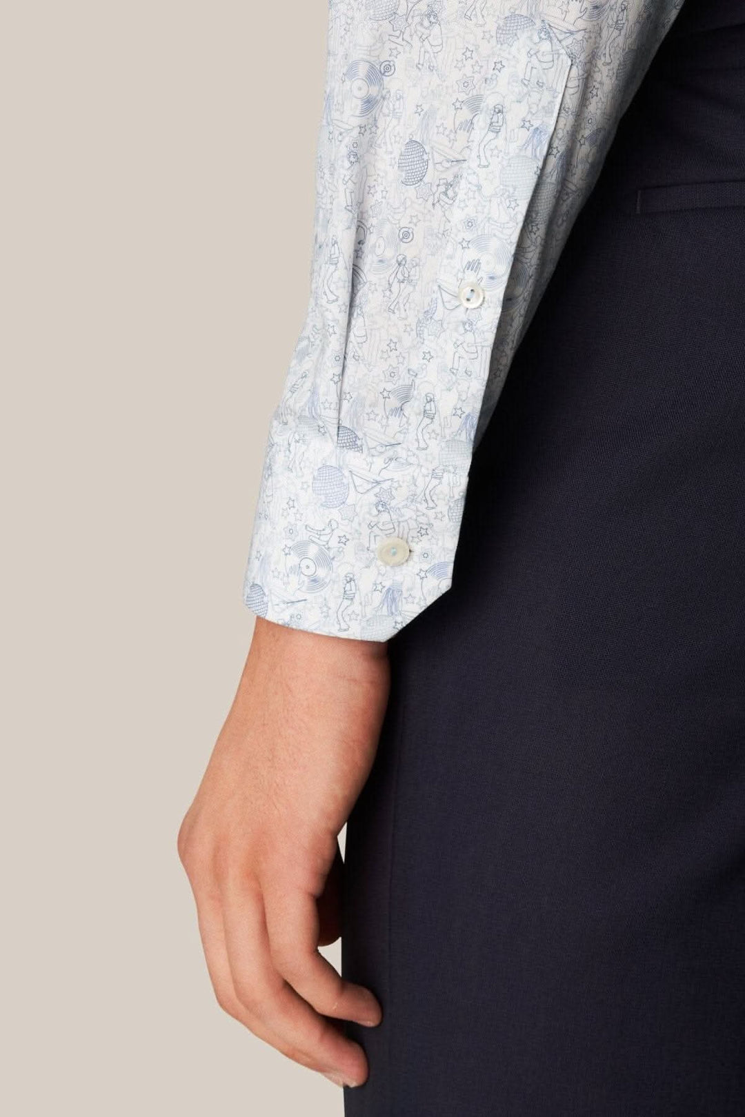Man wearing a light blue twill shirt with a fun &