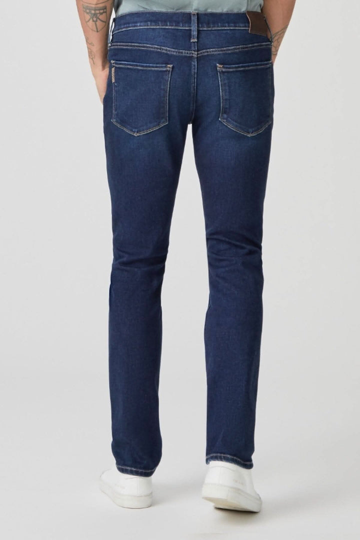 Jeans Lennox Danfrey en délavage foncé avec coupe étroite et détails de moustaches.