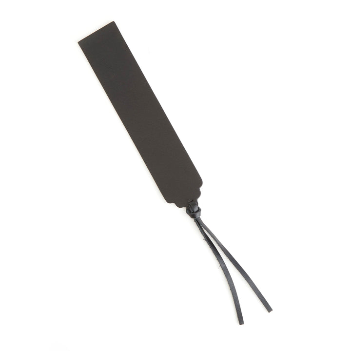 Handmade leather bookmark with tassel, perfect for personalized monogramming.