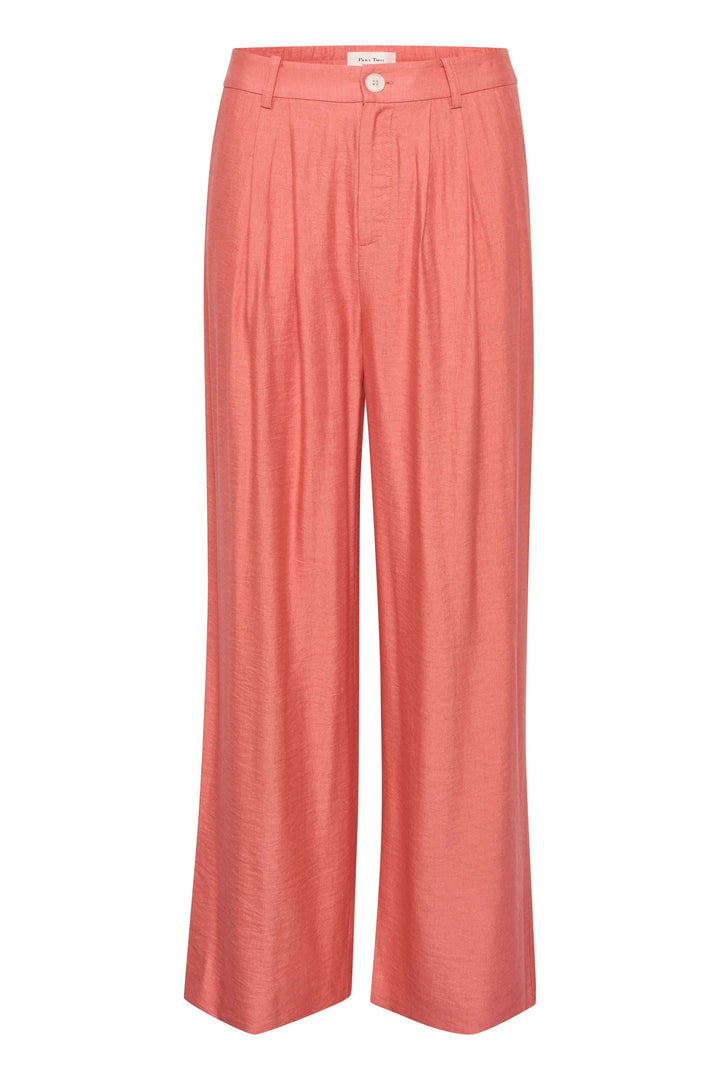 Pantalon Sibille femme à jambe large, couleur corail, en tissu fluide avec pinces et fermeture éclair.