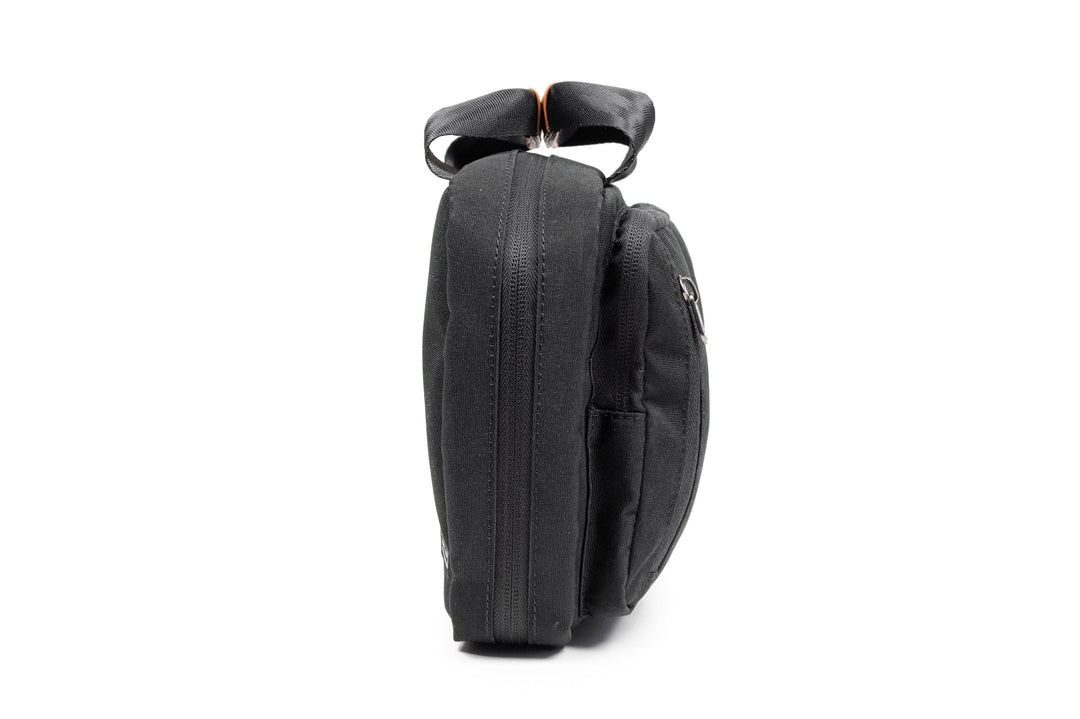 PKG Simcoe recycled essentials bag shown from the side, featuring weather-resistant fabric and sleek design.