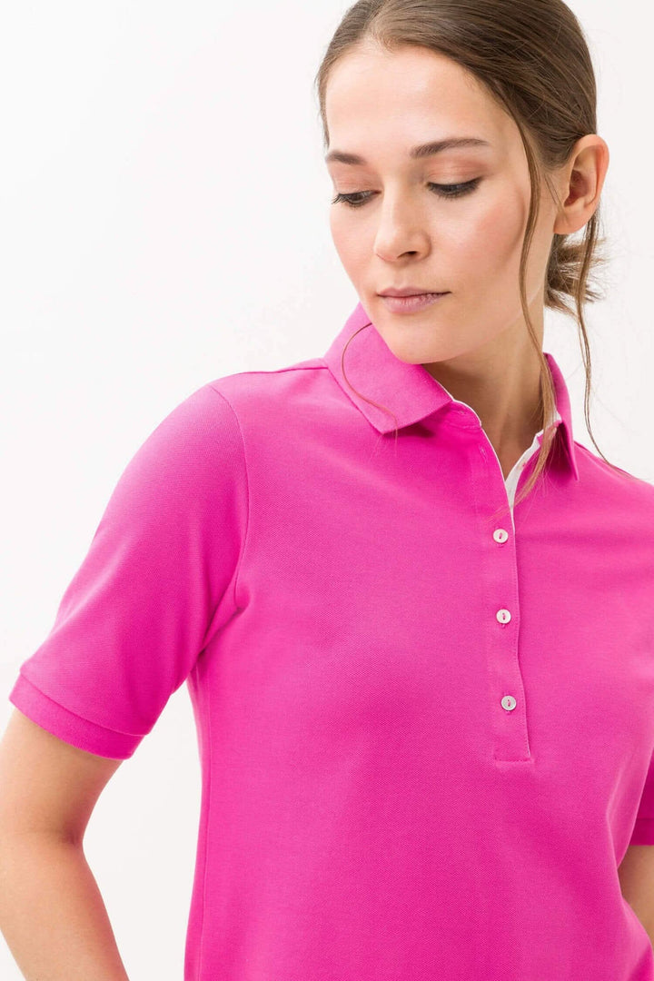 Polo Cleo rose pour femmes, en tissu piqué, offrant confort et respirabilité, idéal pour l&