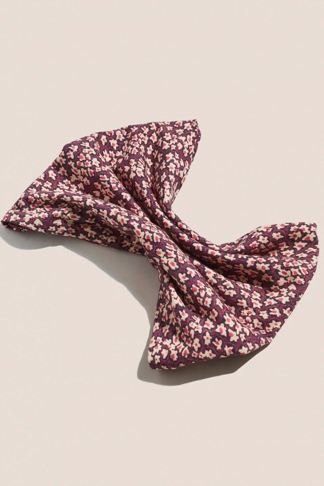 Bandeau de jersey polyvalent avec imprimé fleuri en mauve et rose, idéal comme masque ou cache-cou.
