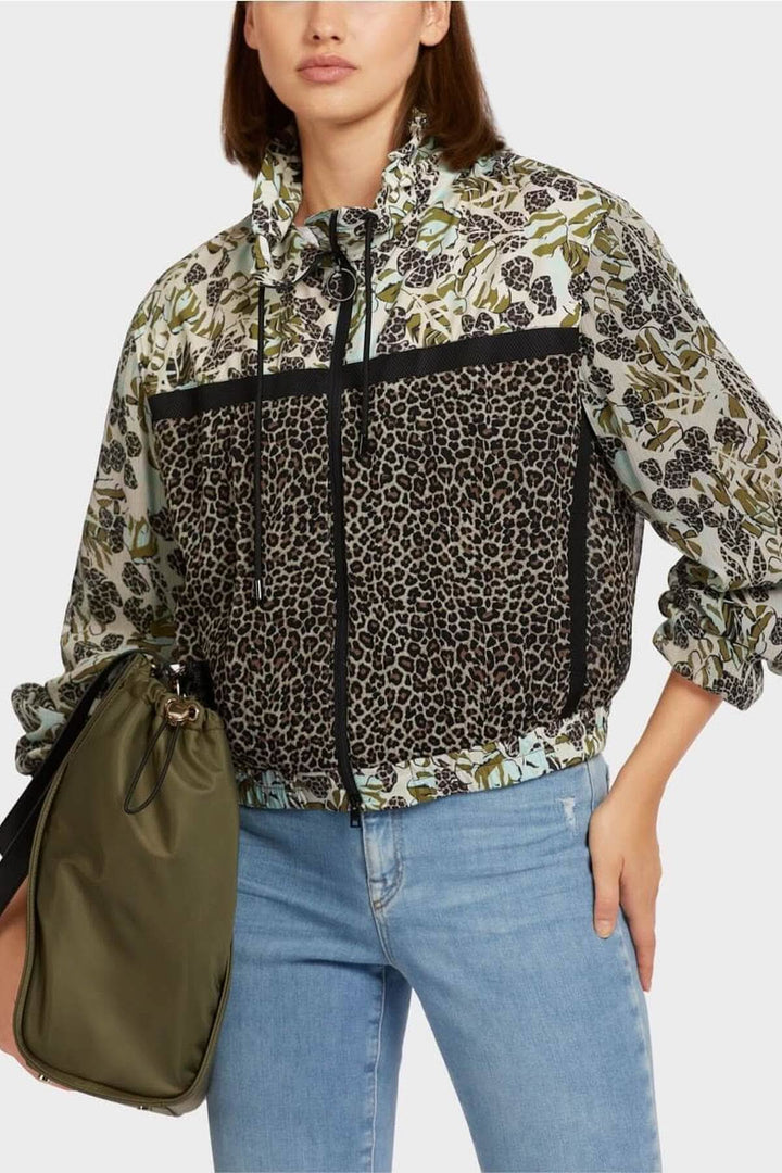 Veste féminine zippée à motifs patchwork, combinant imprimés floraux et léopard, style sport élégant.